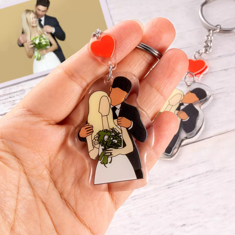 A hand is holding a custom couple faceless portrait keychain