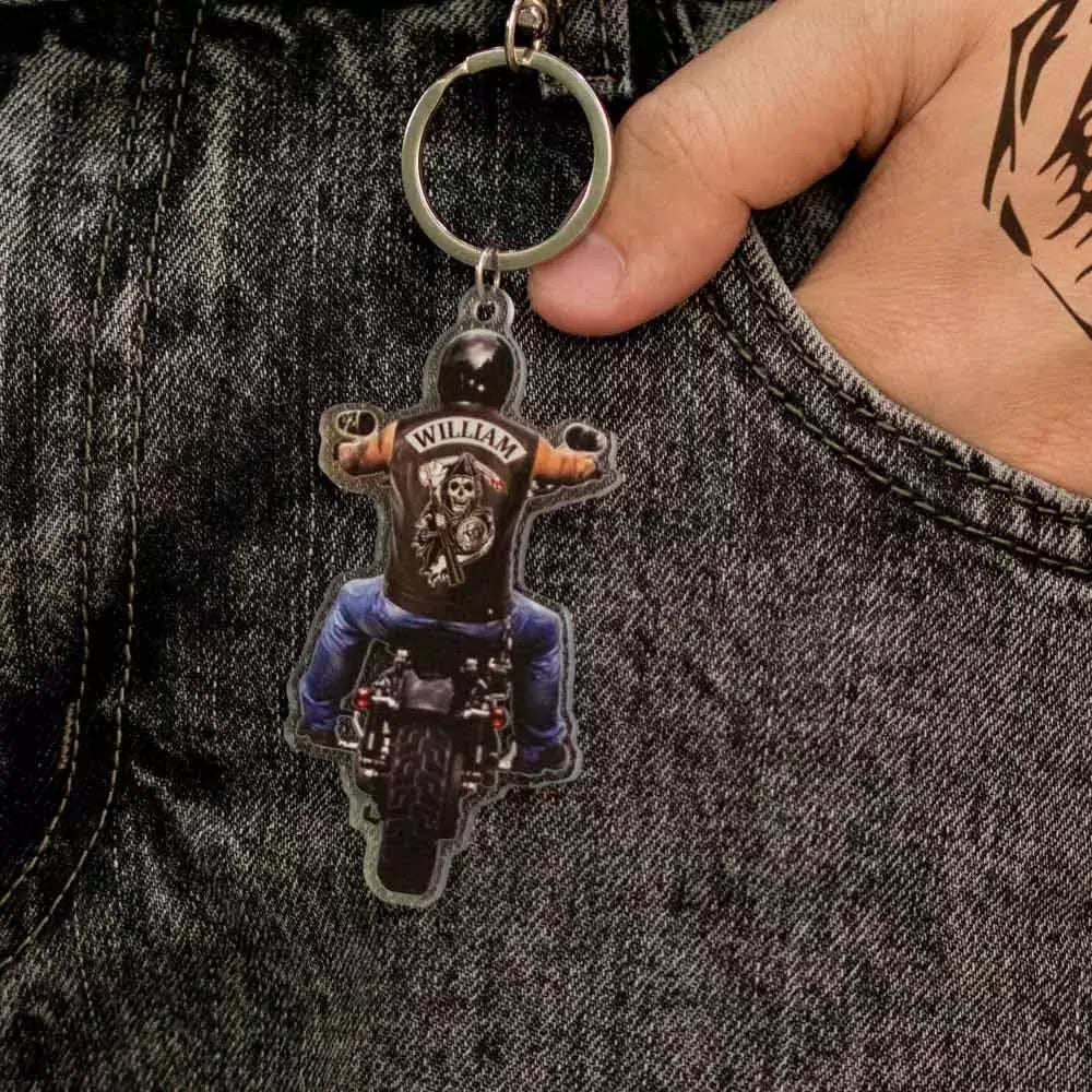 Custom name on the back of biker riding motorcycle keychain