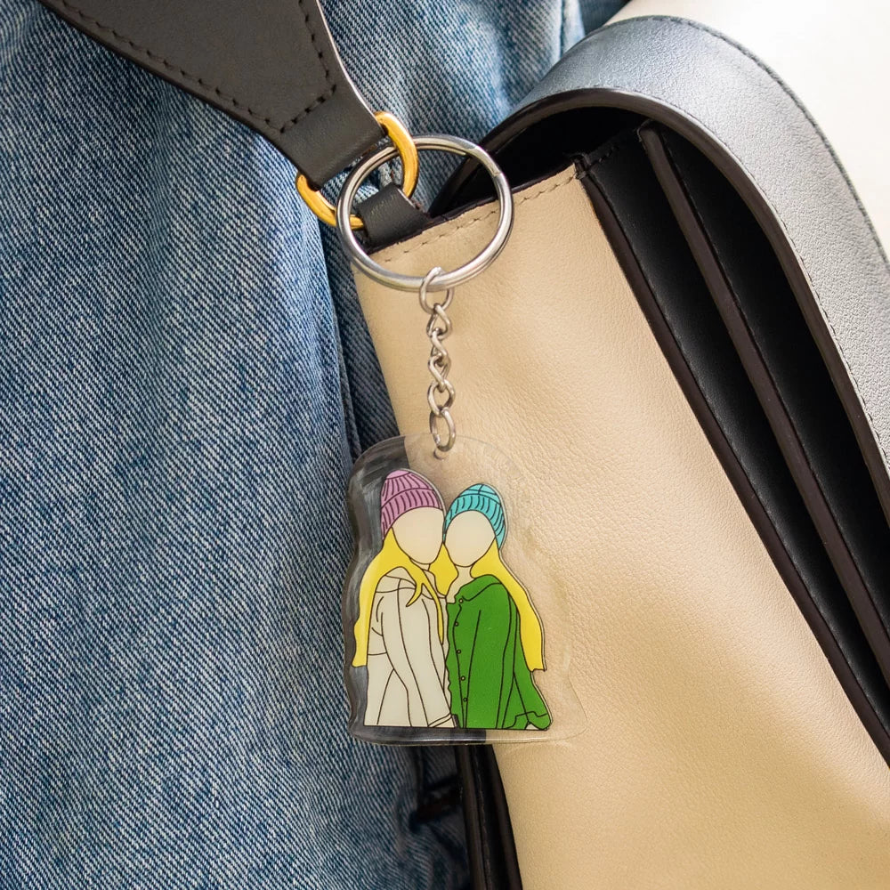 a custom of two women faceless portrait keychain