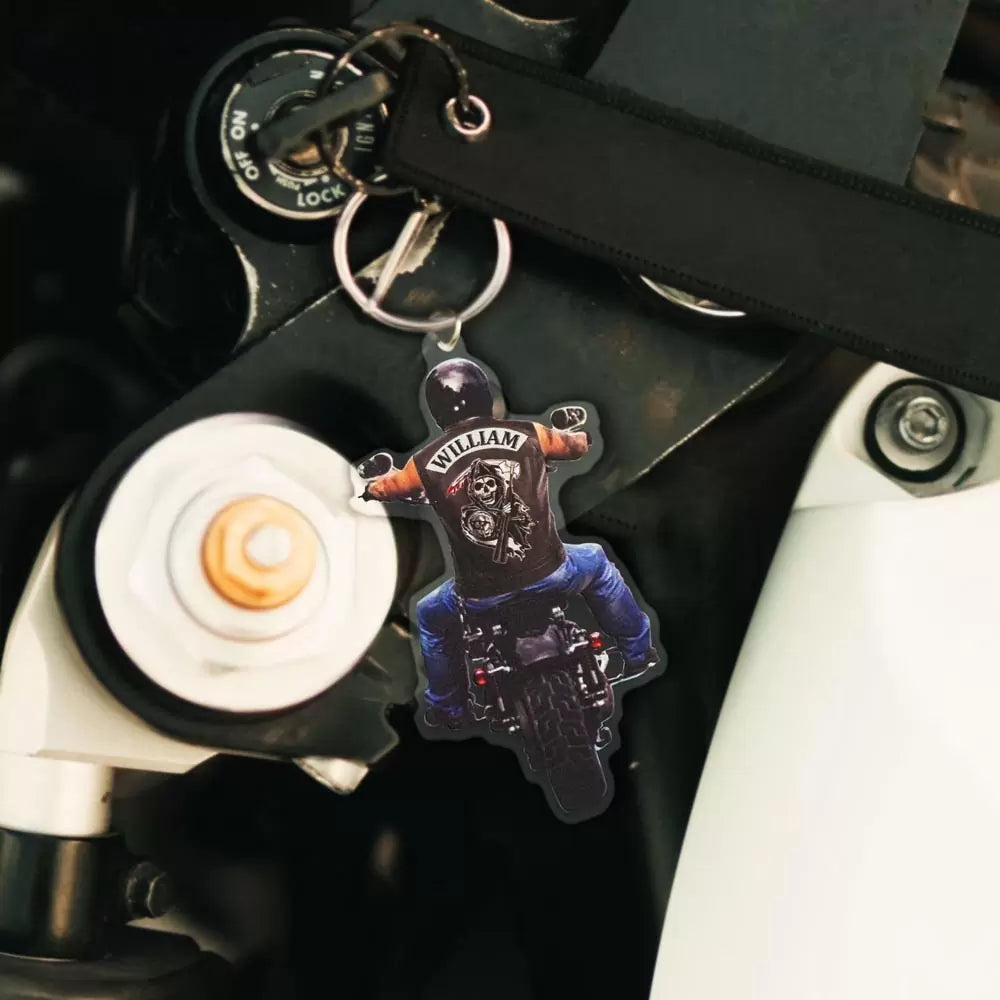 Custom name on the back of biker riding motorcycle keychain