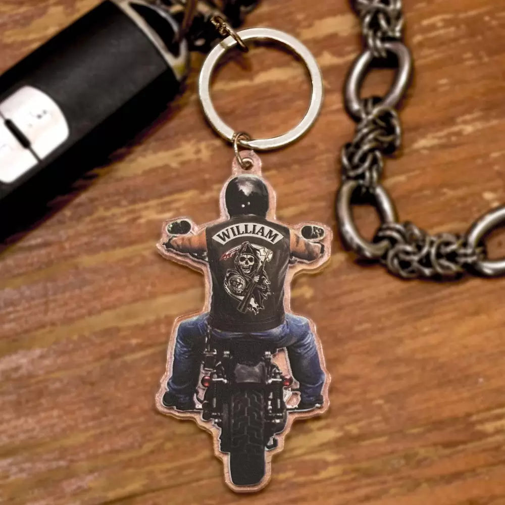 Custom name on the back of biker riding motorcycle keychain