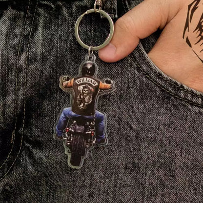 Custom name on the back of biker riding motorcycle keychain