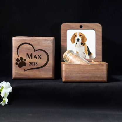 Wooden pet memorial with engraved name and year, featuring a photo of a dog on a black background.