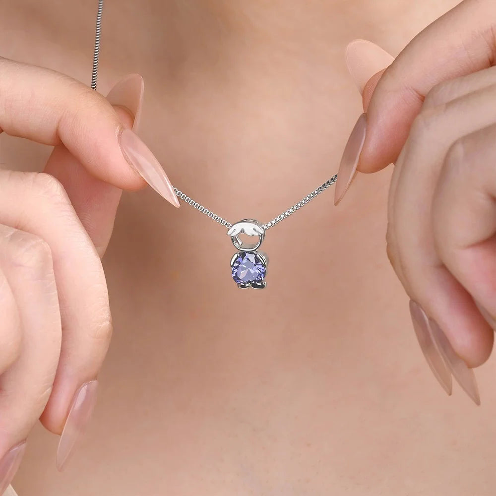 Dainty sterling silver birthstone necklace with boy charm worn on model