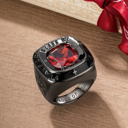 Black custom men’s class ring with red birthstone, engraved class year and inside text, graduation ring design