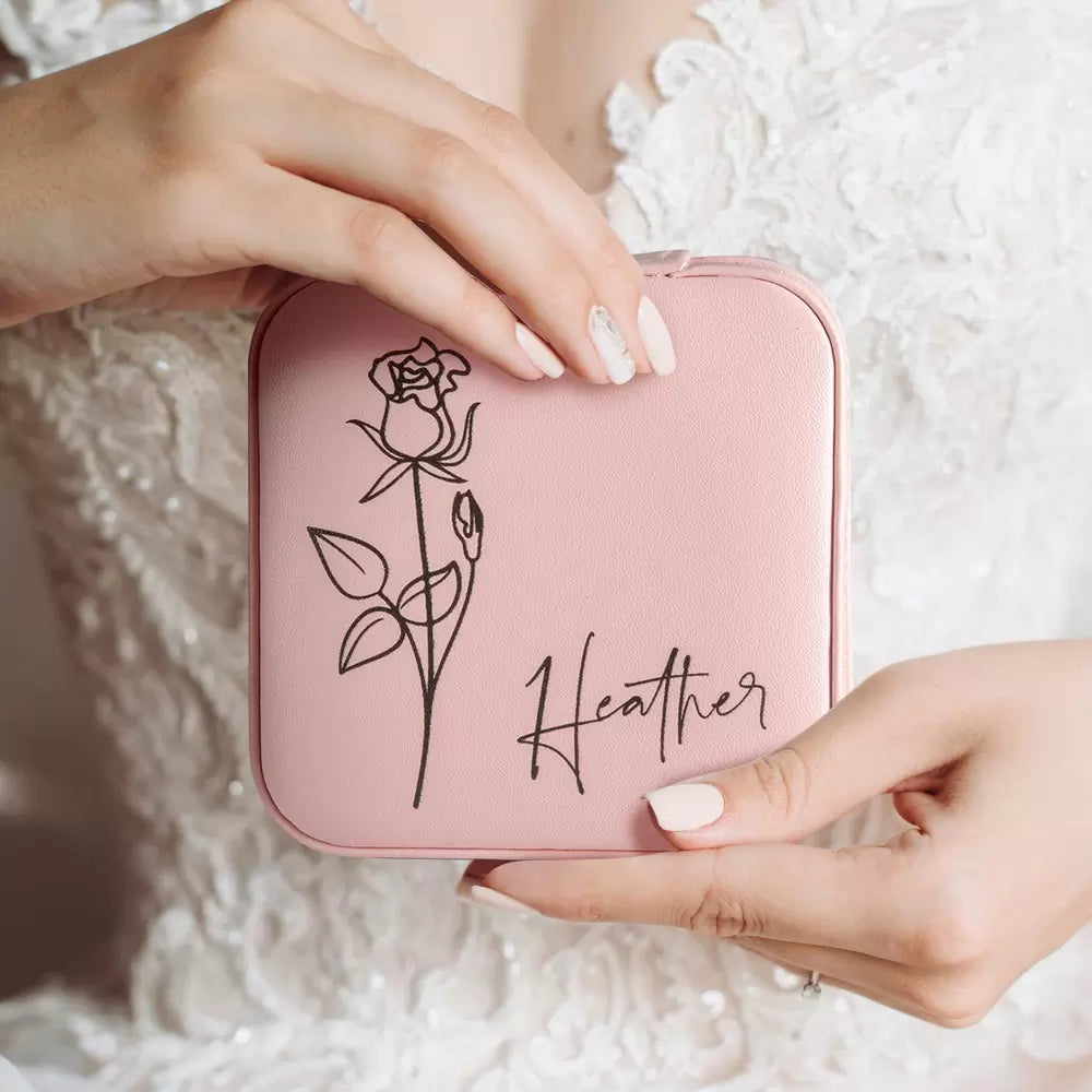 Bridesmaid holding pink personalized birth flower jewelry case