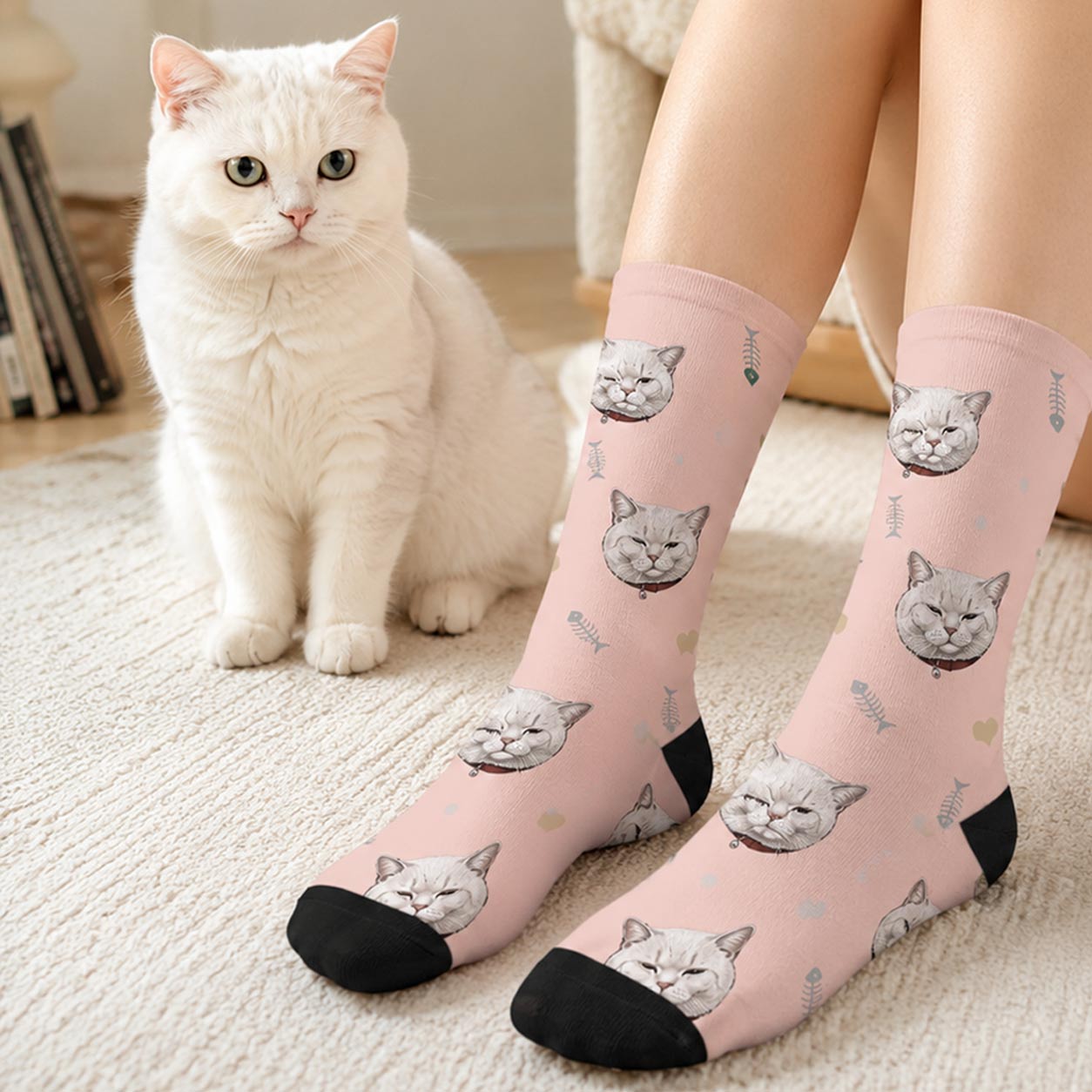 Woman wearing custom cat face crew socks featuring a white cat portrait, sitting indoors with her white cat beside her—personalized gift for cat lovers.
