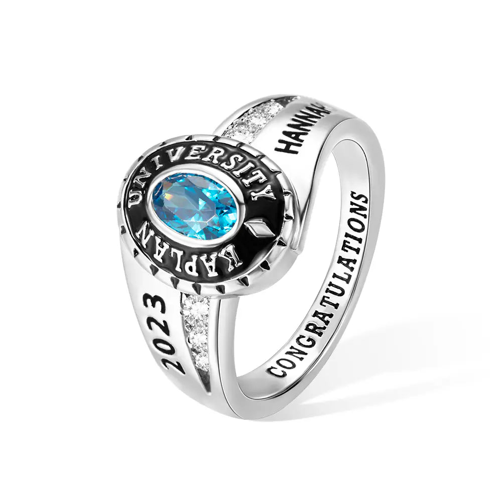 Custom women’s class ring with blue birthstone, engraved university name and graduation year