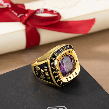 Gold men’s class ring with purple birthstone, engraved class year and school name, custom graduation ring