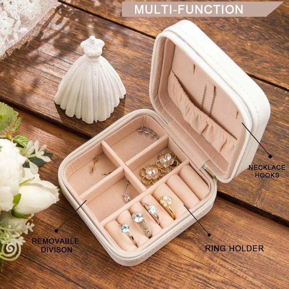 Inside view of jewelry case with ring holder, necklace hooks, and removable divider