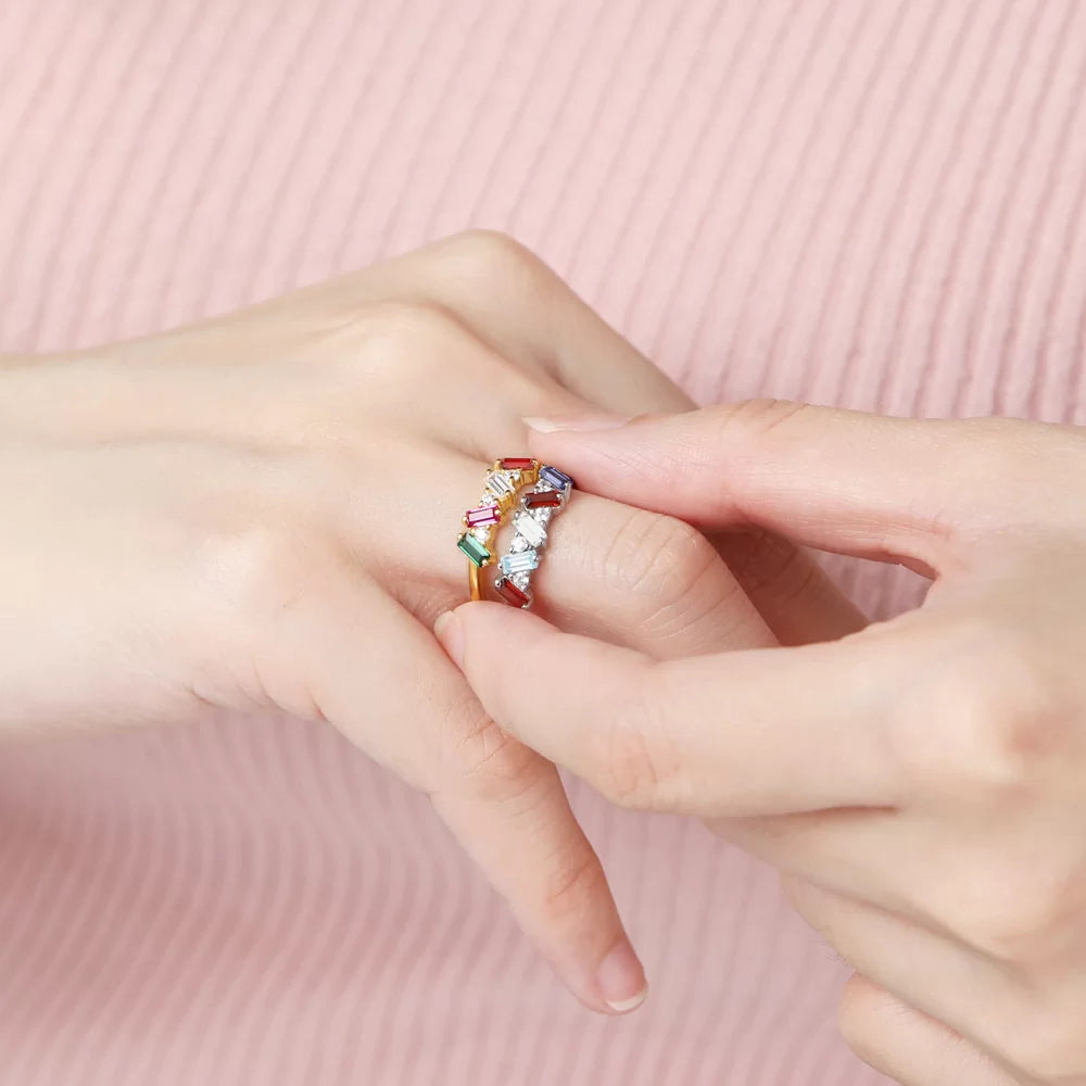 Minimalist baguette birthstone ring worn on hand, showcasing a delicate personalized statement design.
