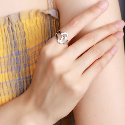 Custom mother and daughter birthstone ring worn on hand, double heart design with engraved names