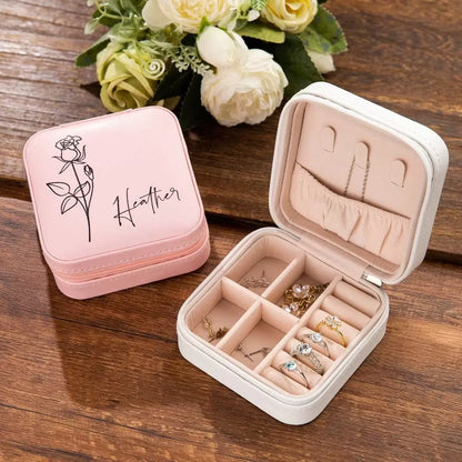 Personalized jewelry cases in pink and white showing organized compartments