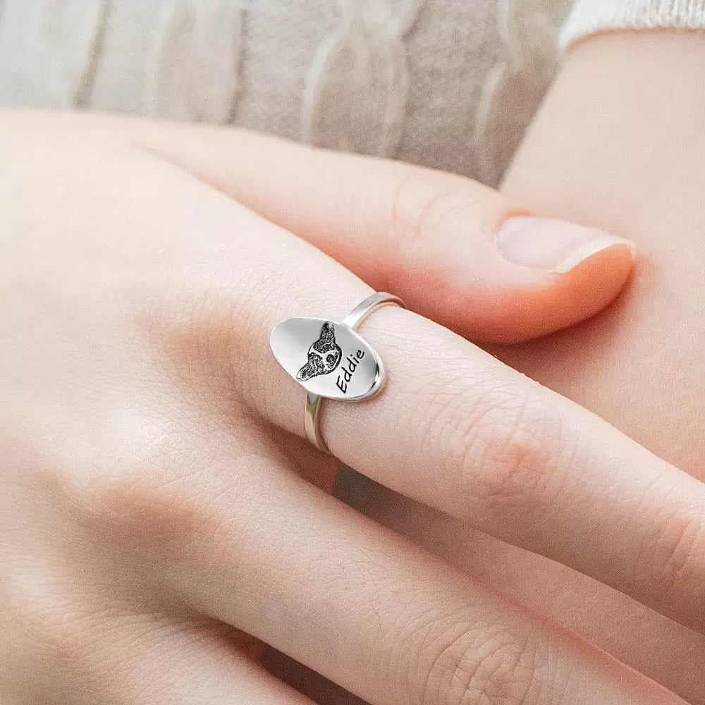 Silver oval shaped signet ring engraved with custom pet portrait and pet name
