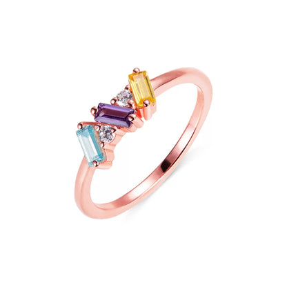 Rose gold three baguette birthstone ring with colorful rectangular stones, minimalist personalized jewelry.