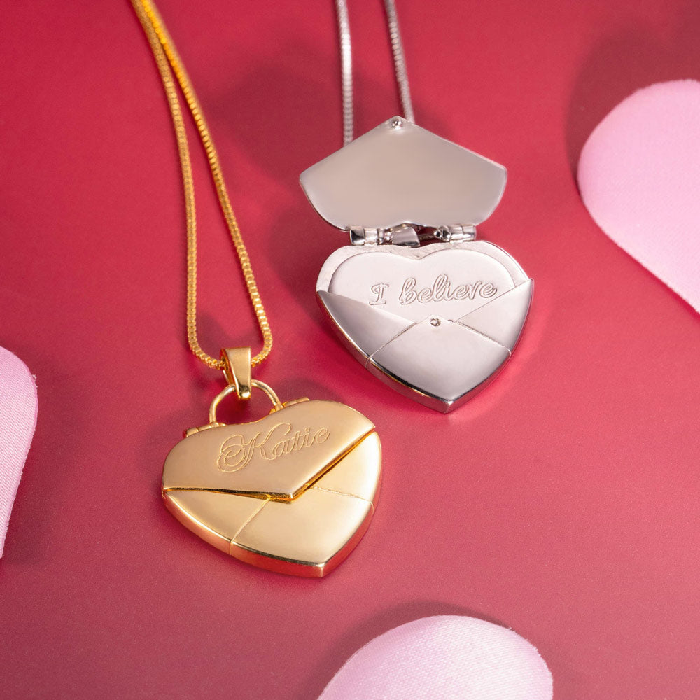 Two pair of gold and silver custom heart shaped necklace with message inside