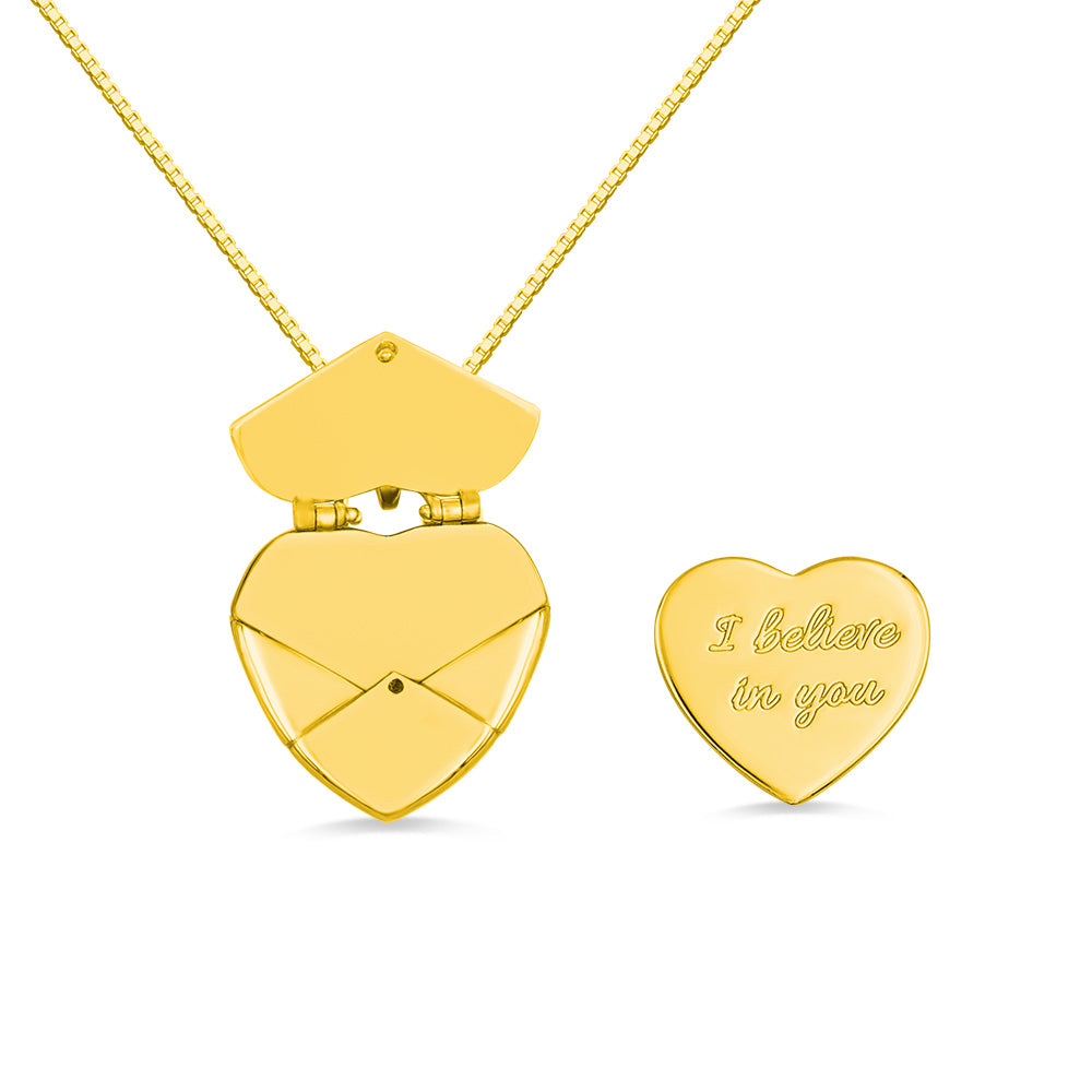 A gold custom heart shaped envelope  necklace with  a heart custom  message featuring " I believe in you