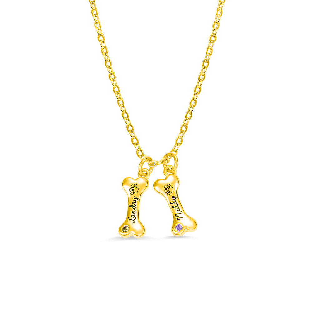 Two lovely  custom gold dog bone pendant with birthstone and dog names engraved 