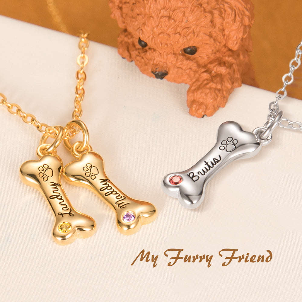 Two custom gold dog bone pendant necklace and a custom silver dog bone pendant necklace